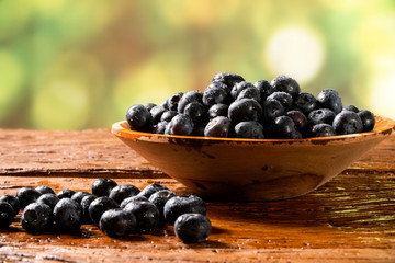 Blueberry on wooden table background. Berries closeup