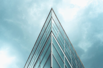 triangle shaped structure against a blue cloudy sky. - Powered by Adobe