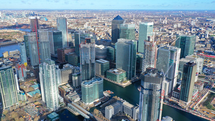 Aerial bird's eye panoramic photo taken by drone of iconic Canary Wharf skyscraper complex and...
