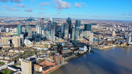 Aerial bird's eye panoramic photo taken by drone of iconic Canary Wharf skyscraper complex and business district, Isle of Dogs, London, United Kingdom