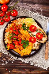 Roasted meat, groats and vegetables