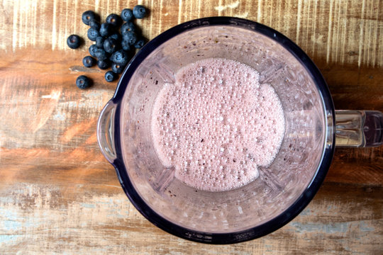 Blueberry Juice Into The Blender Top View. Red Fruit