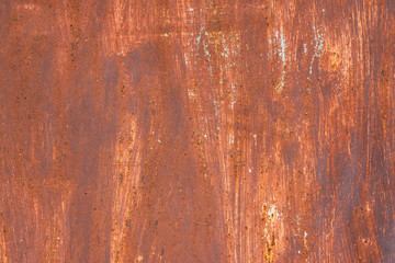 Macro texture of peeled paint on rusty iron closeup.