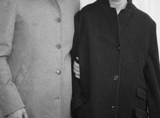 poor family with father and son with old worn coats