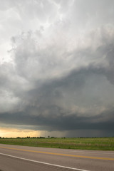 Stormy sky over the road. Severe warned thunderstorm over the Nebraska plains.