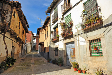 Fototapeta na wymiar Typical street in Cuacos de Yuste, a historical village of the province of Caceres, Extremadura, Spain