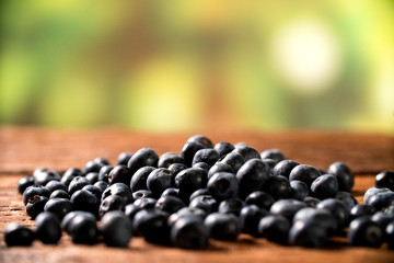 Blueberry on wooden table background. Berries closeup