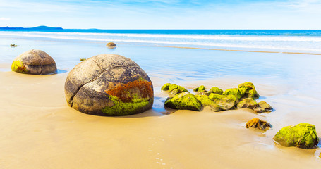 Moeraki boulders on Koyokokha beach in the Otago region, New Zealand. Copy space for text.