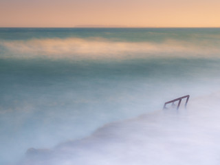 Fototapeta na wymiar view of minimalist stairway to the sea in long exposure photography