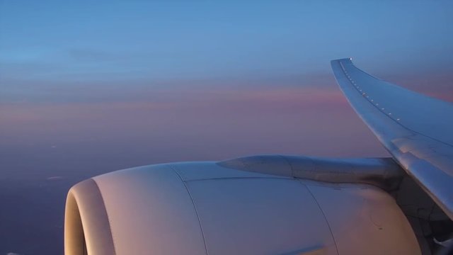 Sunrise over the wing of an airplane. The aircraft on the route from Paris, France to Ho Chi Minh City, Vietnam   
