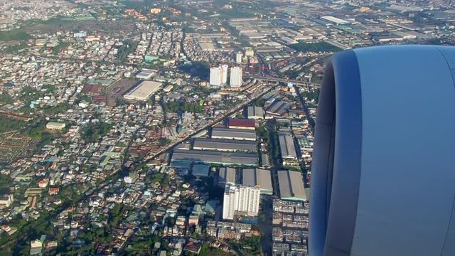 Aerial view of Ho Chi Minh City, Vietnam from the airplane window. The aircraft is approaching Tan Son Nhat Airport (SGN)