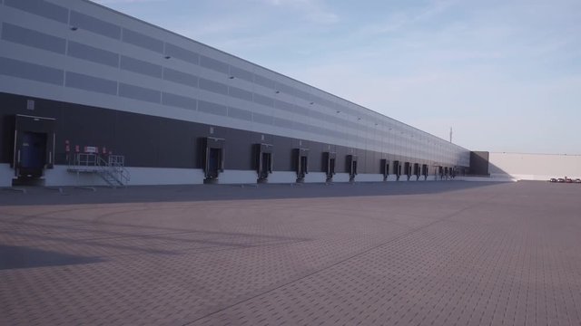 Aerial warehouse in industry area drone footage
