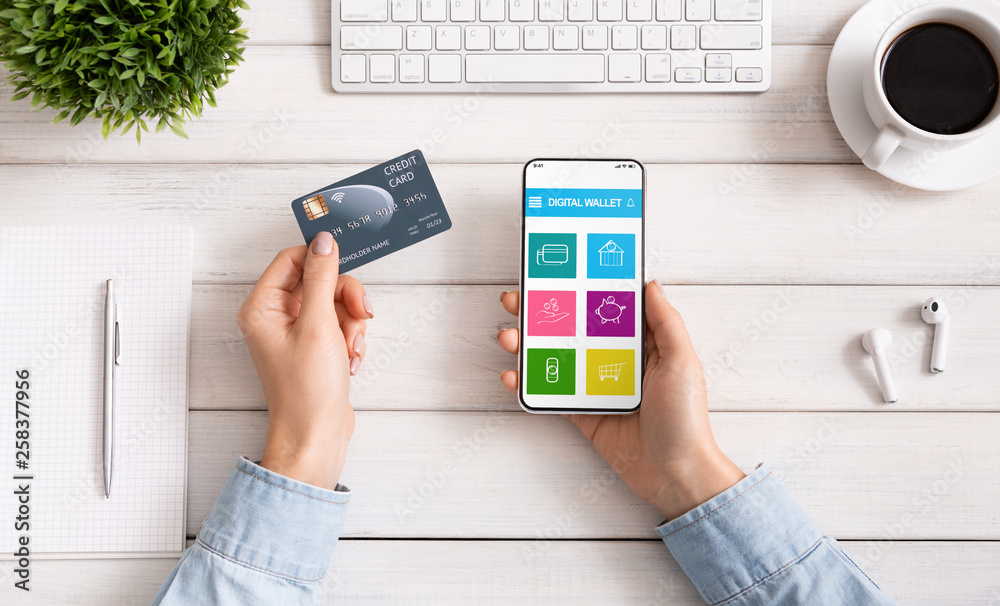 Aufkleber woman using smartphone with digital wallet application and credit card