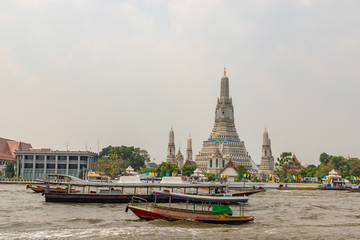 Wat Arun agianst beautiful scene of Chao Phraya river in the morning, Bangkok, Thailand