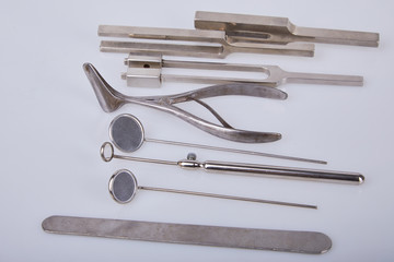 Medical instruments for ENT doctor on white. A set of Otolaryngologist instrument.