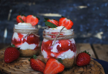 Close-up of homemade strawberry cheesecake in a jar