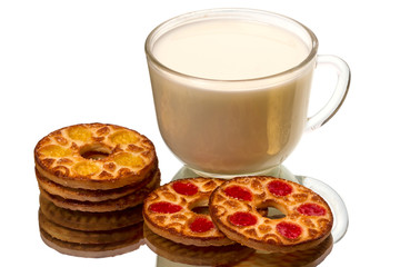 Round cookies and a cup of milk
