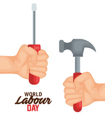 hands with screwdriver and hammer to labour day