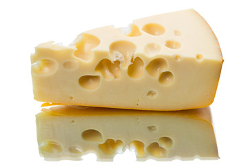 Piece of cheese and reflection on a white