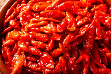 red hot chilli peppers on wooden background, Latin term Capsicum frutescens, Malagueta.