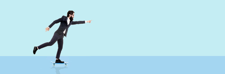 bearded businessman riding a skateboard, man pointing finger on copy space, panoramic image