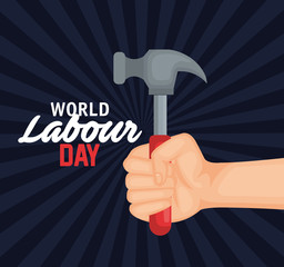 hand with hammer to labour day celebration