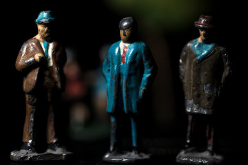 Scale model businessmen that are used in architectural maquette for size indication.
