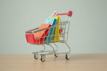 shopping cart with gifts on white background
