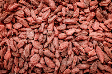 Dried goji berries background tinted 