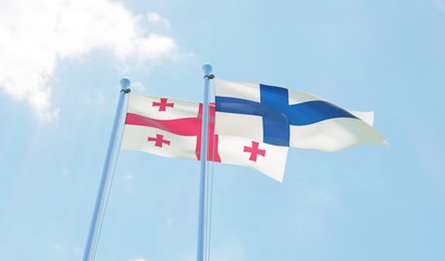 Georgia and Finland, two flags waving against blue sky. 3d image