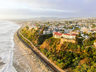 Aerial view of San Clemente beach and coastline before sunset time . San Clemente city in Orange County, California, USA. Travel destination in the South West Coast. Famous beach for surfer. - obrazy, fototapety, plakaty