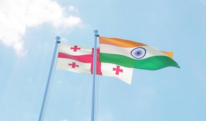 Georgia and India, two flags waving against blue sky. 3d image