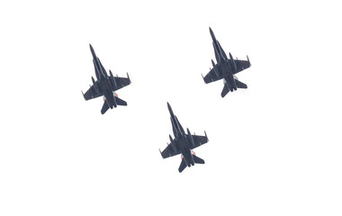 Group of three army fighter jets shot from below. Silhouettes of military war aircrafts with bombs...