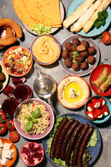 Middle eastern or arabic dishes and assorted meze, concrete rustic background. Falafel. Turkish...
