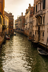 Obraz na płótnie Canvas Italy, Venice, view of canals among the typical Venetian houses.