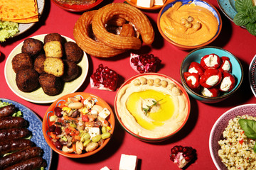 Middle eastern or arabic dishes and assorted meze, concrete rustic background. Falafel. Turkish...