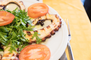 Octopus salad with rocket and tomatoes