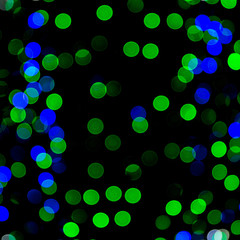 Unfocused abstract colourful bokeh on black background. defocused and blurred many round light