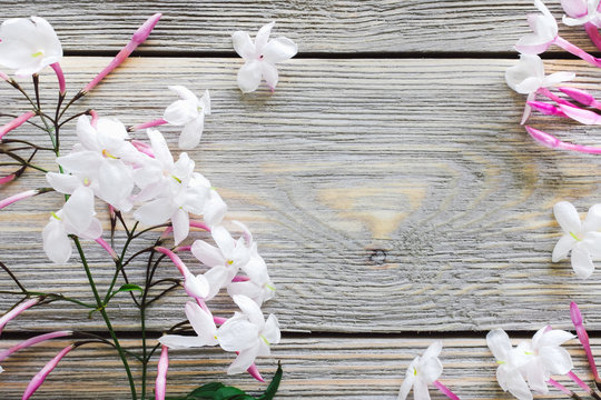 Jasmine Flowers on White Washed Wood
