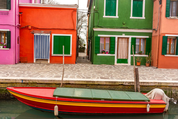 Fototapeta na wymiar Italy, Venice, Burano, canals and boats among the typical colored houses.