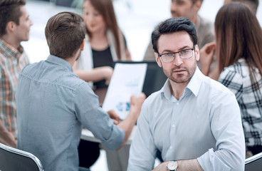 close up.successful businessman against the background of the business team