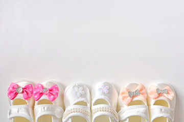 Baby girl fashion wear background with booties