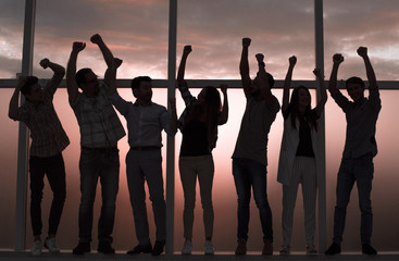 Fototapeta premium happy business team standing by the window