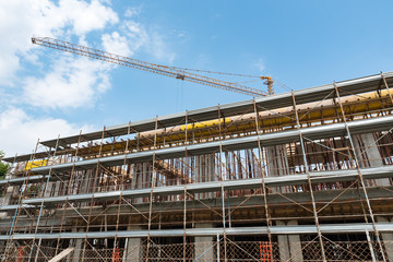 Scaffolds and cranes in a construction site