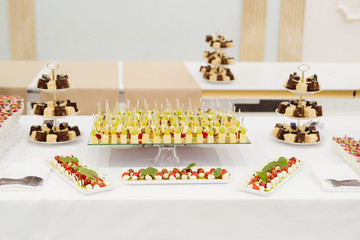 Restaurant table setting with food fnd delishes