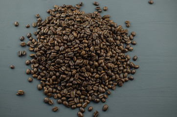 Turkish or Greek Coffee in heart shaped roasted coffee beans on white rustic wooden table from top view. Traditional tasty refreshment greek or turkish coffee from greek or turkish cuisine culture