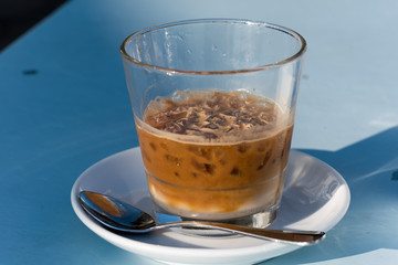 Cold coffee with ice close up
