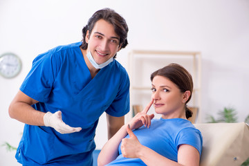 Woman visiting male doctor for plastic surgery