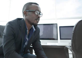 close up. portrait of a successful businessman in the workplace