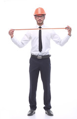 in full growth. young architect with yellow tape measure